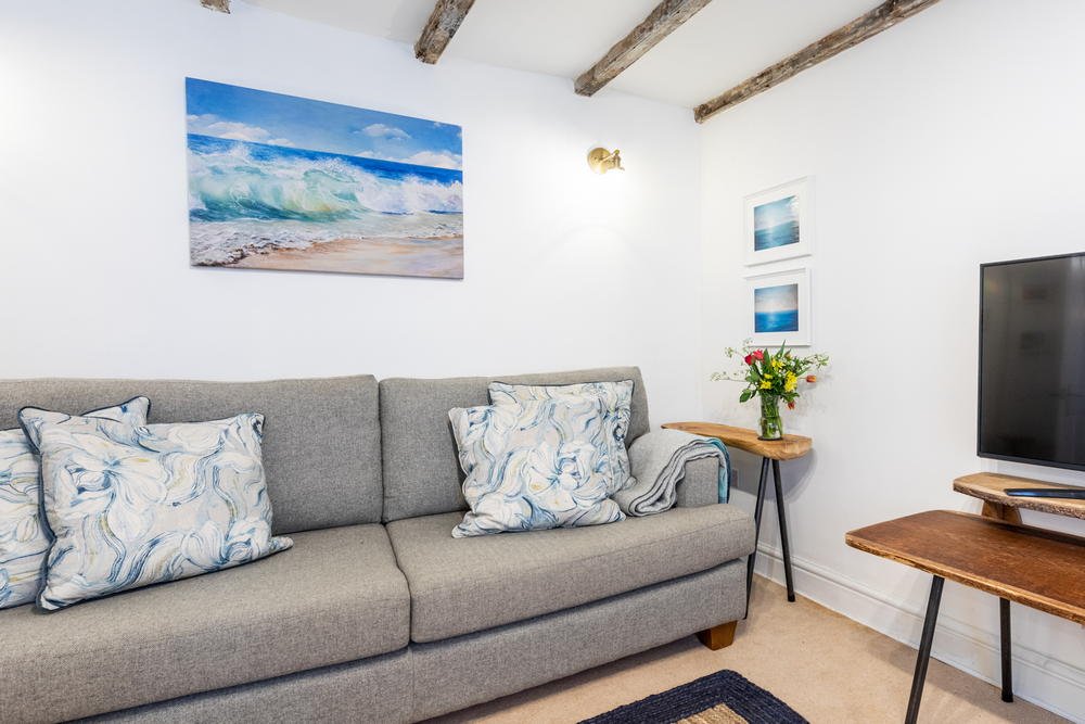 Living room with coastal paintings